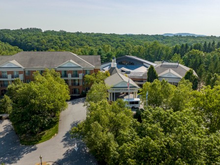 An aerial view of the resort at Glade Springs, surrounded by lush green trees and rolling hills.